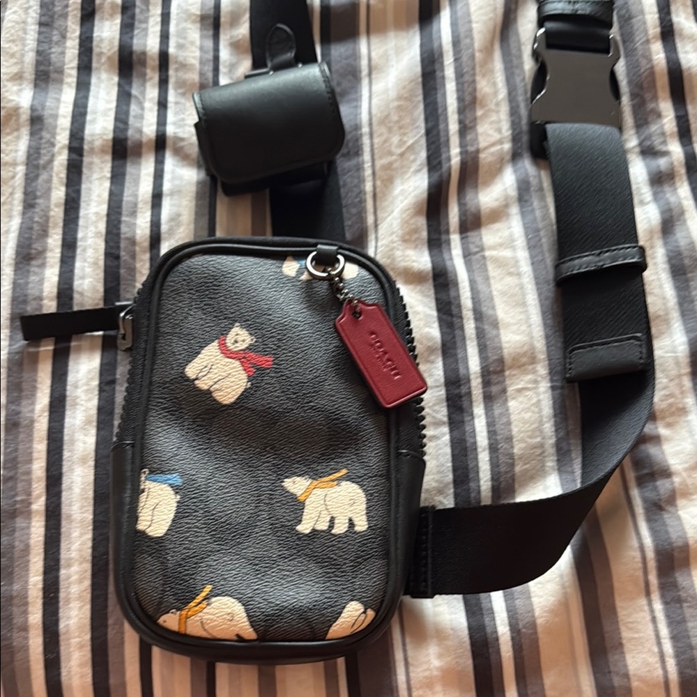 Coach Black Crossbody Bag with Bear Print and Air Pod case.